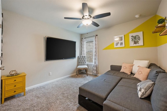 carpeted living room with a ceiling fan and baseboards