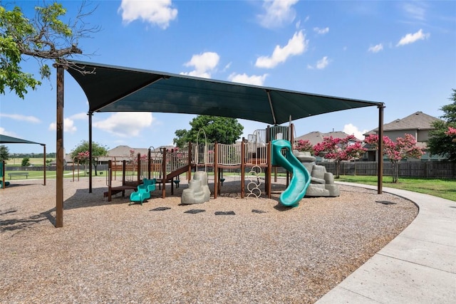 community jungle gym featuring fence