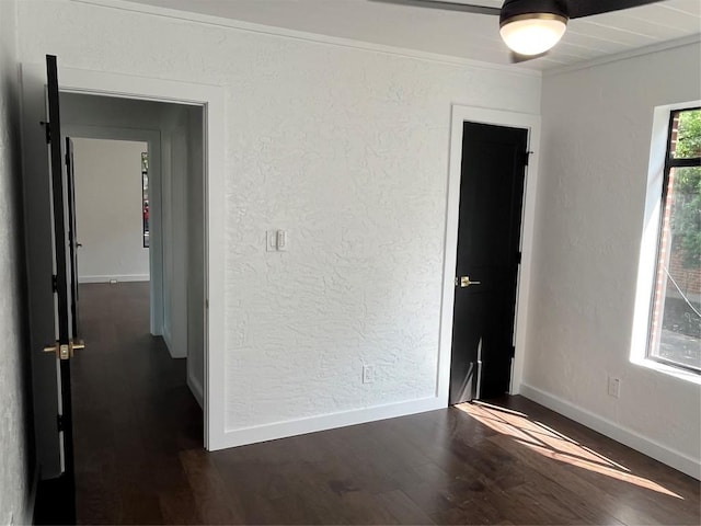 5611 Joe Sayers Ave, Austin, TX 78756 - unfurnished room with dark wood-style flooring, baseboards, and a textured wall