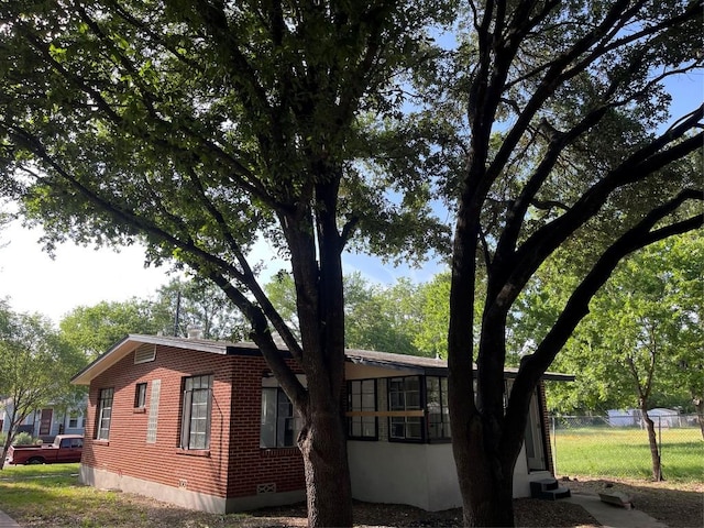 5611 Joe Sayers Ave, Austin, TX 78756 - view of side of property with brick siding