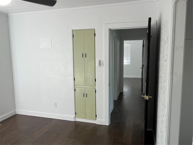 5611 Joe Sayers Ave, Austin, TX 78756 - empty room with dark wood-type flooring, baseboards, and crown molding