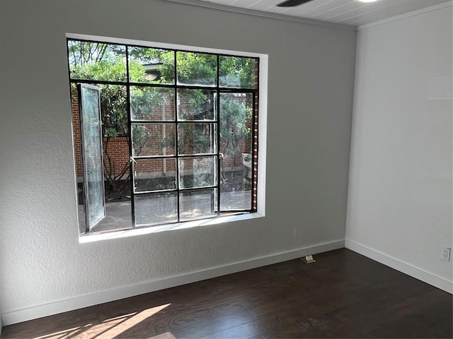 5611 Joe Sayers Ave, Austin, TX 78756 - spare room with baseboards and dark wood-type flooring