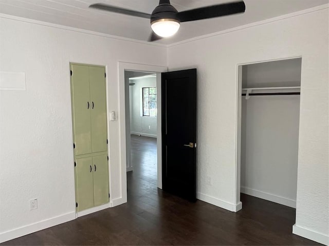 5611 Joe Sayers Ave, Austin, TX 78756 - unfurnished bedroom featuring dark wood-style floors, a closet, baseboards, and a ceiling fan