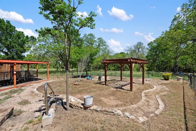 view of jungle gym with a pergola and fence