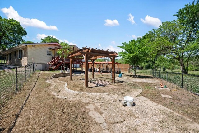3602 Ferguson Ln, Austin, TX 78754 - fenced backyard with a pergola and stairs