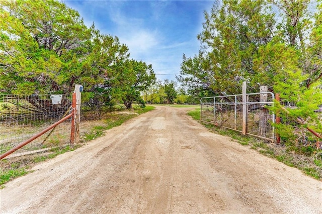 view of road featuring a gated entry and a gate