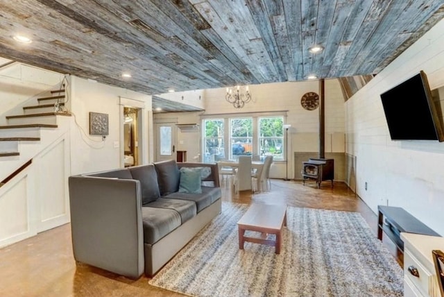 living room with a wood stove, recessed lighting, wooden ceiling, stairway, and a chandelier
