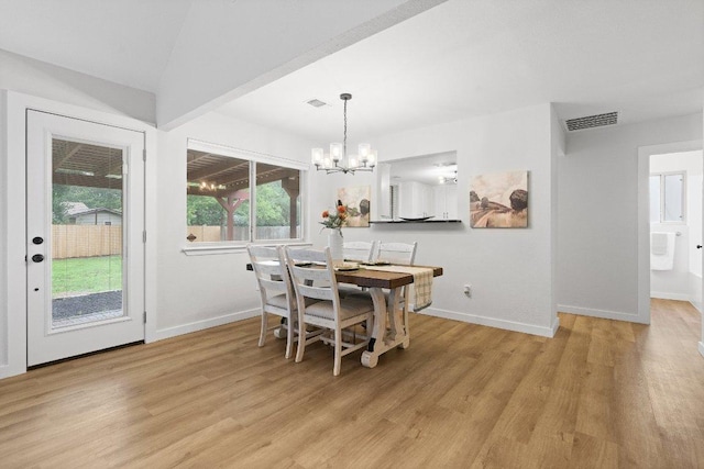 10416 Doering Ln, Austin, TX 78750 - dining room featuring light wood-type flooring and a chandelier