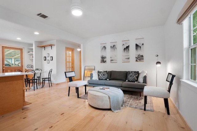1405 Cometa St, Austin, TX 78721 - living room featuring light wood-type flooring and recessed lighting