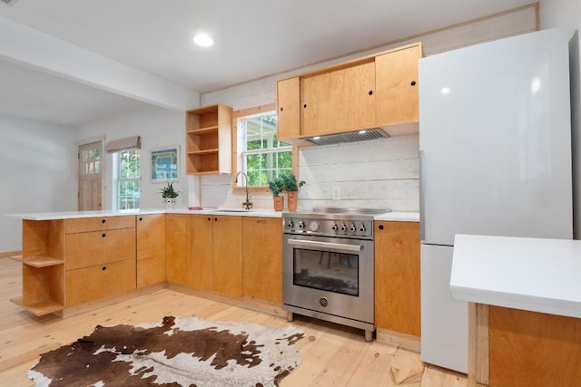 1405 Cometa St, Austin, TX 78721 - kitchen featuring open shelves, stainless steel stove, freestanding refrigerator, range hood, and recessed lighting