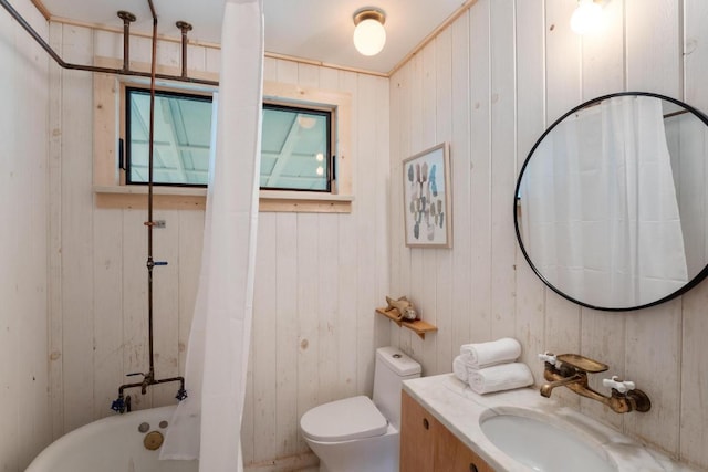 1405 Cometa St, Austin, TX 78721 - bathroom featuring vanity, wooden walls, and shower / bathtub combination with curtain