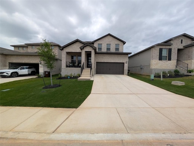 view of front facade featuring driveway, a front yard, and a garage