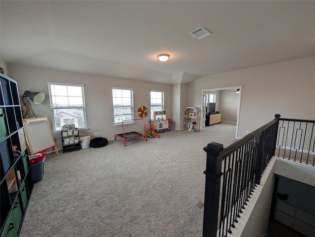 game room featuring carpet flooring, visible vents, baseboards, and a healthy amount of sunlight