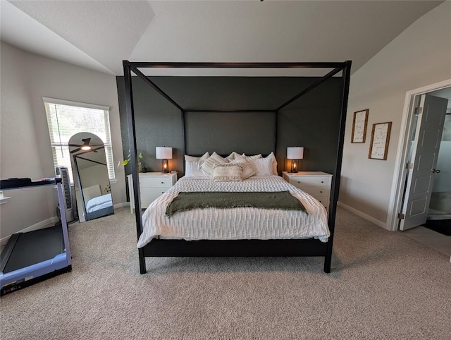 bedroom with lofted ceiling, baseboards, and carpet floors