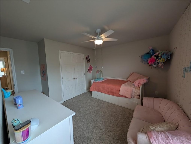 carpeted bedroom featuring a closet and ceiling fan