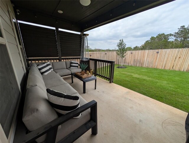 view of patio with an outdoor living space and a fenced backyard
