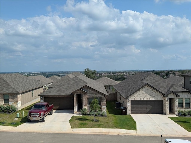 3030 Charyn Way, New Braunfels, TX 78132 - view of front of property with concrete driveway, a garage, brick siding, and a residential view