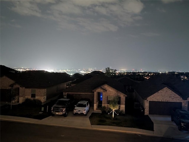 3030 Charyn Way, New Braunfels, TX 78132 - view of front facade with driveway, brick siding, and a garage