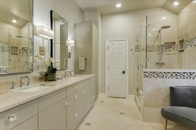 505 Newhall Cv, Austin, TX 78746 - full bathroom featuring a shower stall, double vanity, tile patterned floors, and recessed lighting