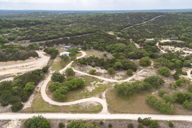 bird's eye view featuring a wooded view