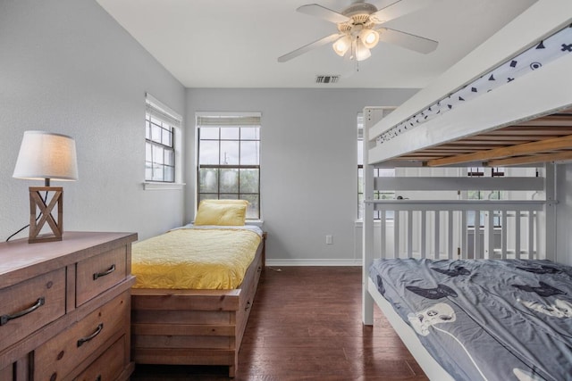 bedroom featuring visible vents, dark wood finished floors, and baseboards