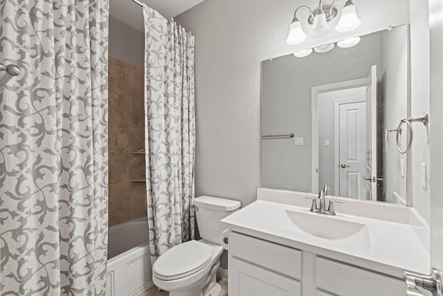 bathroom with toilet, shower / bathtub combination with curtain, a textured wall, and vanity