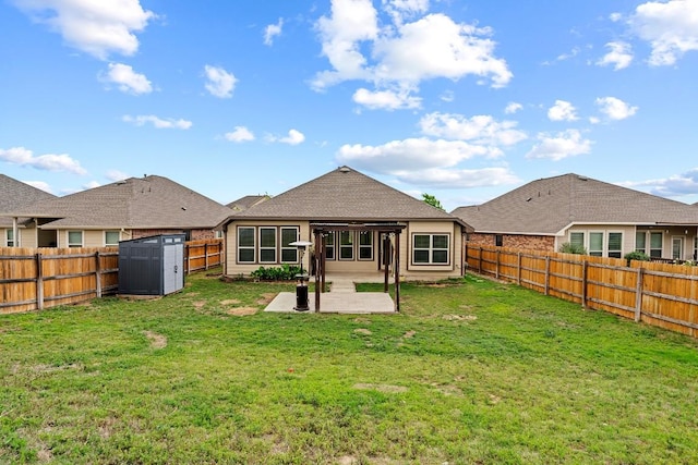rear view of property featuring an outdoor structure, a storage unit, a fenced backyard, and a patio area