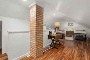 128 E Cedar St, La Grange, TX 78945 - bonus room with wood finished floors and lofted ceiling