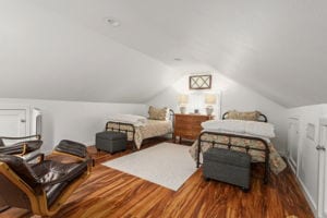 128 E Cedar St, La Grange, TX 78945 - bedroom featuring wood finished floors and lofted ceiling