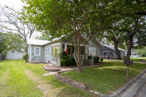 128 E Cedar St, La Grange, TX 78945 - view of front of home with a front lawn
