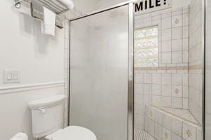 128 E Cedar St, La Grange, TX 78945 - full bathroom with a stall shower and toilet