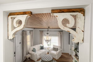128 E Cedar St, La Grange, TX 78945 - living area with a notable chandelier and wood ceiling