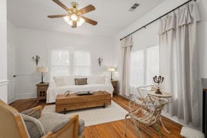 128 E Cedar St, La Grange, TX 78945 - living area featuring visible vents, wood finished floors, and a ceiling fan