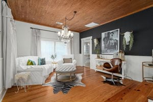 128 E Cedar St, La Grange, TX 78945 - sitting room featuring a chandelier, wood finished floors, and wood ceiling