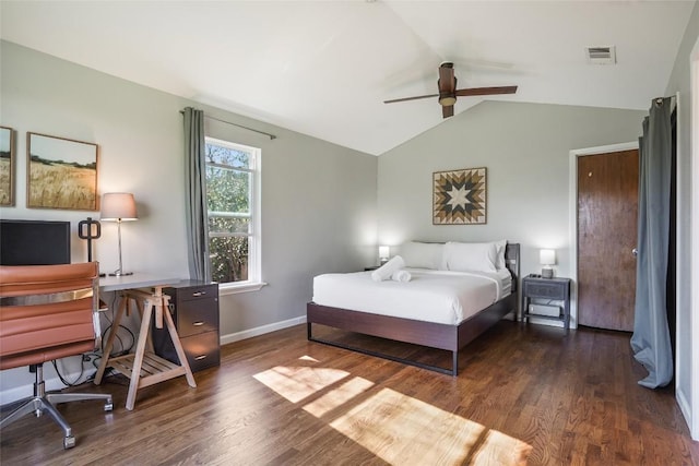 bedroom featuring lofted ceiling, visible vents, baseboards, wood finished floors, and a ceiling fan