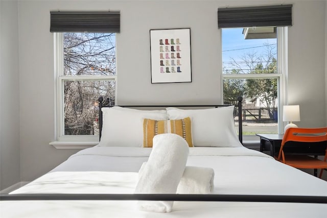 bedroom featuring multiple windows
