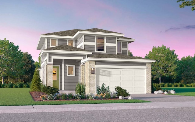 view of front of home featuring driveway and an attached garage