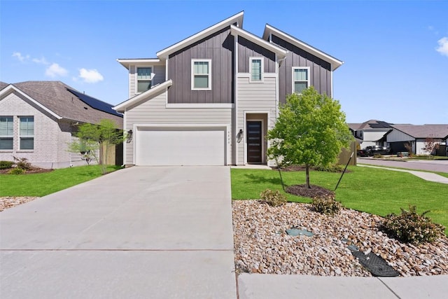 modern home with concrete driveway, a garage, a front lawn, and board and batten siding