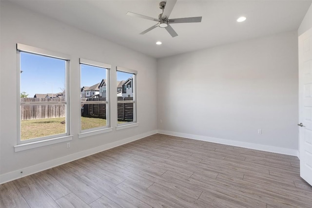 unfurnished room with baseboards, recessed lighting, a ceiling fan, and light wood-style floors