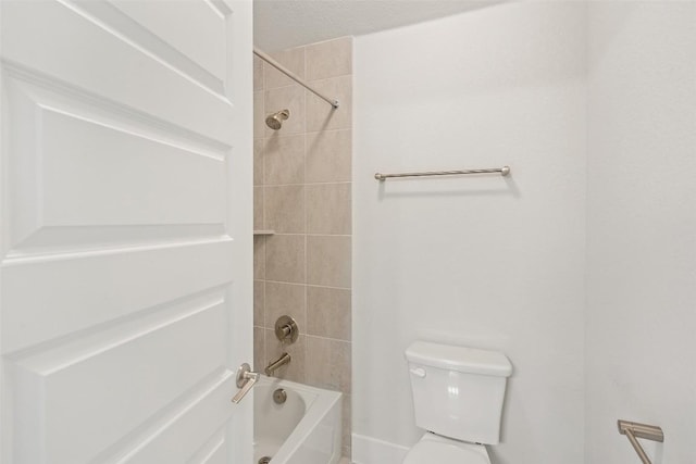 bathroom featuring toilet and tub / shower combination
