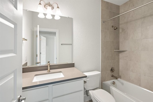 full bathroom with toilet, a textured wall, vanity, and  shower combination