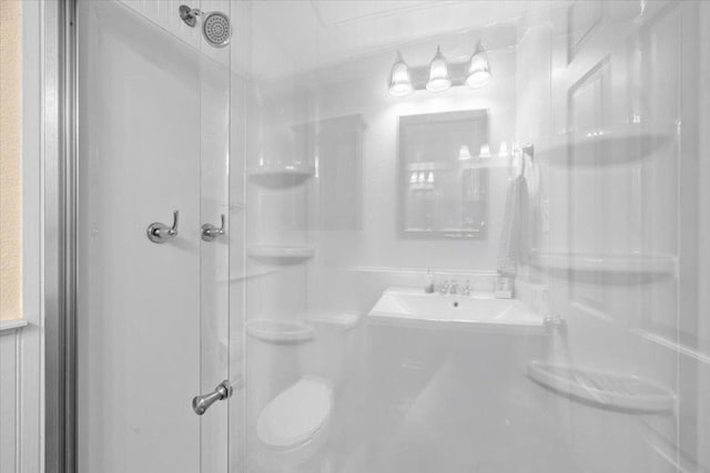 2605 Enfield Rd Unit 209, Austin, TX 78703 - full bathroom with a stall shower, toilet, and a sink