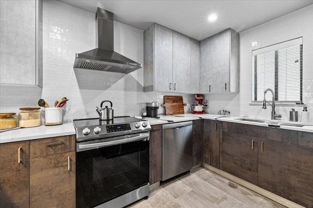 2605 Enfield Rd Unit 209, Austin, TX 78703 - kitchen with appliances with stainless steel finishes, wall chimney range hood, tasteful backsplash, and a sink