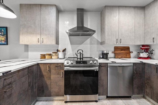 2605 Enfield Rd Unit 209, Austin, TX 78703 - kitchen with stainless steel appliances, wall chimney exhaust hood, light countertops, tasteful backsplash, and dark brown cabinets