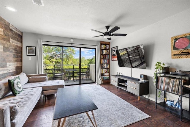 2605 Enfield Rd Unit 209, Austin, TX 78703 - living area featuring wood walls, ceiling fan, a textured ceiling, wood finished floors, and recessed lighting