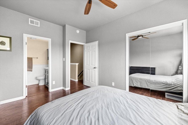 2605 Enfield Rd Unit 209, Austin, TX 78703 - bedroom with wood finished floors, a closet, baseboards, ceiling fan, and a textured wall