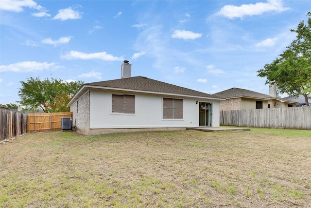 2009 Barnett Dr, Cedar Park, TX 78613 - rear view of house featuring a fenced backyard and a chimney