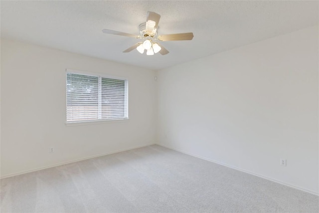 2009 Barnett Dr, Cedar Park, TX 78613 - spare room featuring light colored carpet, ceiling fan, and baseboards
