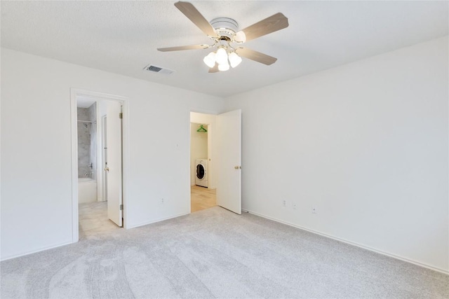 2009 Barnett Dr, Cedar Park, TX 78613 - unfurnished bedroom featuring light carpet and ceiling fan