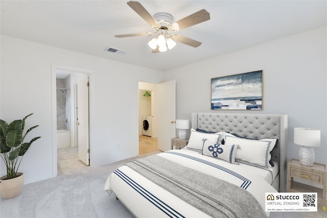 2009 Barnett Dr, Cedar Park, TX 78613 - carpeted bedroom with washer / clothes dryer, ceiling fan, baseboards, and connected bathroom